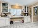 Kitchen boasts extensive counter space and white cabinets at 104 E Berkshire Cir, Longwood, FL 32779