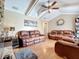 Relaxing living room with a stone fireplace and hardwood floors at 104 E Berkshire Cir, Longwood, FL 32779