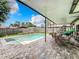 Inviting pool area with patio furniture and covered lanai at 104 E Berkshire Cir, Longwood, FL 32779