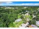 Expansive aerial view showing the home nestled within a lush, green landscape and neighborhood at 1624 Rivers Edge Dr, Orlando, FL 32825