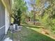 Large backyard with mature trees, shed, and in-ground pool at 1624 Rivers Edge Dr, Orlando, FL 32825