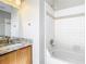 Bright bathroom with white tiled shower and bathtub with modern fixtures at 1624 Rivers Edge Dr, Orlando, FL 32825