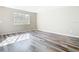Bright bedroom with modern flooring and natural light streaming through a large window at 1624 Rivers Edge Dr, Orlando, FL 32825