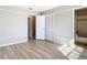Neutral bedroom featuring modern wood flooring, trim, and a closet at 1624 Rivers Edge Dr, Orlando, FL 32825