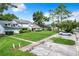 Charming two-story home with a well-maintained lawn, mature trees, and a driveway at 1624 Rivers Edge Dr, Orlando, FL 32825