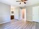 Spacious main bedroom with wood floors, ceiling fan, and convenient access to bathroom and closet spaces at 1624 Rivers Edge Dr, Orlando, FL 32825