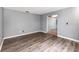 Inviting living room boasts stylish wood flooring and a neutral color palette at 6682 Sw 106Th Ln, Ocala, FL 34476