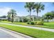 House exterior with palm trees and a green lawn at 2708 Ponkan Meadow Dr, Apopka, FL 32712