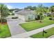 Exterior view of the house with a brick driveway at 2708 Ponkan Meadow Dr, Apopka, FL 32712