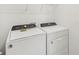 This laundry room features modern, front-loading washer and dryer units at 527 Kennedy Dr, Lake Alfred, FL 33850