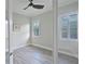 Cozy bedroom with natural light, plantation shutters, and neutral wall color at 5509 Meadow Hill Loop, Lady Lake, FL 32159