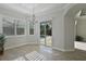 The dining room features a chandelier and access to the pool at 5509 Meadow Hill Loop, Lady Lake, FL 32159