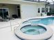 Beautiful pool and jacuzzi with plenty of patio space for entertaining at 5509 Meadow Hill Loop, Lady Lake, FL 32159