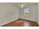 Bedroom featuring a light ceiling fan, warm wood-look floors and a bright window at 821 E Story Rd, Winter Garden, FL 34787