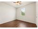 Simple bedroom featuring wood floors and a window at 821 E Story Rd, Winter Garden, FL 34787