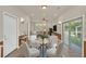 Cozy dining area with glass table, stylish chairs, and natural light from sliding glass door at 821 E Story Rd, Winter Garden, FL 34787