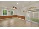 Bright living room with sliding glass doors to the backyard and recessed lighting at 821 E Story Rd, Winter Garden, FL 34787