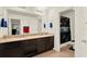 Bathroom featuring double vanity, granite counters, large mirror, and tiled floors at 5232 Villa Rosa Ave, Saint Cloud, FL 34771