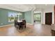 Charming dining room featuring a tray ceiling, tile floors, and ample natural light for Gathering gatherings at 5232 Villa Rosa Ave, St Cloud, FL 34771