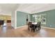 Bright dining room with tray ceilings, tile floors, and large windows offering plenty of natural light at 5232 Villa Rosa Ave, St Cloud, FL 34771