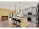 Modern kitchen featuring granite countertops, stainless steel appliances, pendant lighting, and a breakfast bar at 5232 Villa Rosa Ave, St Cloud, FL 34771