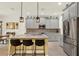 Stylish kitchen featuring gray cabinets, granite countertops, stainless steel appliances, and a center island with seating at 5232 Villa Rosa Ave, St Cloud, FL 34771