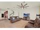 Comfortable living room with tile floors, a ceiling fan, and cozy seating, perfect for Gathering gatherings at 5232 Villa Rosa Ave, St Cloud, FL 34771