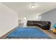 Large living room featuring hardwood floors, a sectional sofa, and a blue rug at 5232 Villa Rosa Ave, St Cloud, FL 34771