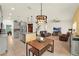 Spacious living space featuring a modern kitchen, cozy seating area, and a dining table, perfect for entertaining at 5232 Villa Rosa Ave, St Cloud, FL 34771