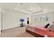 Large main bedroom featuring neutral carpet, a tray ceiling, and multiple windows for ample natural light at 5232 Villa Rosa Ave, St Cloud, FL 34771