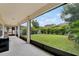 Enclosed patio with lush backyard views and outdoor kitchen prep area at 5232 Villa Rosa Ave, St Cloud, FL 34771