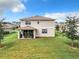 Spacious backyard with home and patio visible at 8060 Cherrystone St, Leesburg, FL 34748