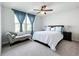 Bedroom with queen-size bed and chaise lounge at 8060 Cherrystone St, Leesburg, FL 34748