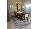 Dining room boasts a chandelier, and large window allowing for natural light at 2719 Lakemoor Dr, Orlando, FL 32828