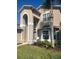 Inviting two-story home with stucco finish, manicured lawn, and well-kept landscaping at 2719 Lakemoor Dr, Orlando, FL 32828