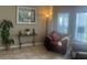 Cozy living area with plush armchairs, stylish lamps, and serene decor at 2719 Lakemoor Dr, Orlando, FL 32828