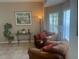 Comfortable living area with plush armchairs, stylish lamps, and serene decor at 2719 Lakemoor Dr, Orlando, FL 32828