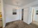 Cozy dining area featuring neutral color scheme, modern lighting, and convenient closet space at 4401 Thornbriar Ln # 202, Orlando, FL 32822