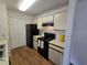 Well-organized kitchen with modern appliances, efficient layout and ample storage at 4401 Thornbriar Ln # 202, Orlando, FL 32822