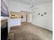 Inviting living room with fireplace, carpet, and an open layout to the kitchen at 4401 Thornbriar Ln # 202, Orlando, FL 32822