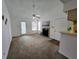 Bright living room with a fireplace, ceiling fan, and access to the outdoors at 4401 Thornbriar Ln # 202, Orlando, FL 32822
