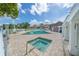 Community pool and hot tub with beautiful landscaping and blue skies at 4401 Thornbriar Ln # 202, Orlando, FL 32822