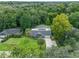 Beautiful aerial view of property with mature trees and screened-in pool at 668 Coral Way, Winter Springs, FL 32708
