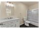 Bathroom with single vanity, tub, and updated fixtures at 912 W 5Th St, Lakeland, FL 33805