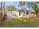 Side view of a newly built light colored single story home at 912 W 5Th St, Lakeland, FL 33805