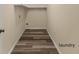 Laundry area with vinyl flooring and overhead shelving at 912 W 5Th St, Lakeland, FL 33805