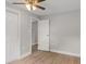 Empty bedroom with light grey walls, ceiling fan, and closet at 1321 Cloverlawn Ave, Orlando, FL 32806