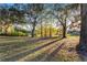 Picturesque park scene with picnic tables and benches nestled amongst mature trees offering shady spots for relaxation at 1321 Cloverlawn Ave, Orlando, FL 32806