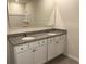 Double vanity bathroom with granite countertop and shower at 2008 Red Rock Rd, New Smyrna Beach, FL 32168