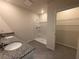 Bathroom with double vanity, shower, and linen closet at 2008 Red Rock Rd, New Smyrna Beach, FL 32168